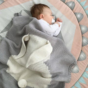 Couverture tricotée motif lapin pour bébé
